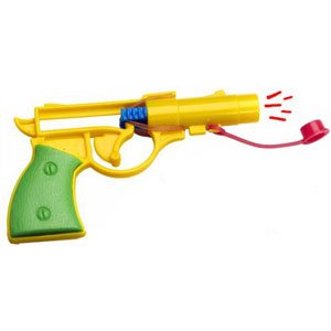 Mini Pistol powered by rubber band makes Pop! sound when replaceable cap is affixed. In bag.