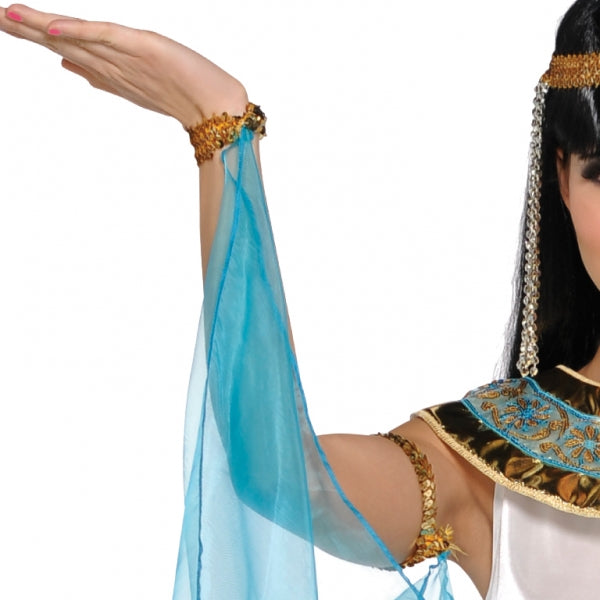 Queen Cleopatra Ladies Fancy Dress Costume is a white satin dress with a finely detailed gold and turquoise fabric belt| matching fabric headdress with faux jewel accent| and ornate gold padded collar with blue band accent and gold embroidery details. The Queen Cleopatra Costume is dramatically finished with gold arm bands and cuffs with an attached sheer cape. Adult Queen Cleopatra Costume includes Headdress| Collar| Dress| Armbands| Cuffs and Attached cape.