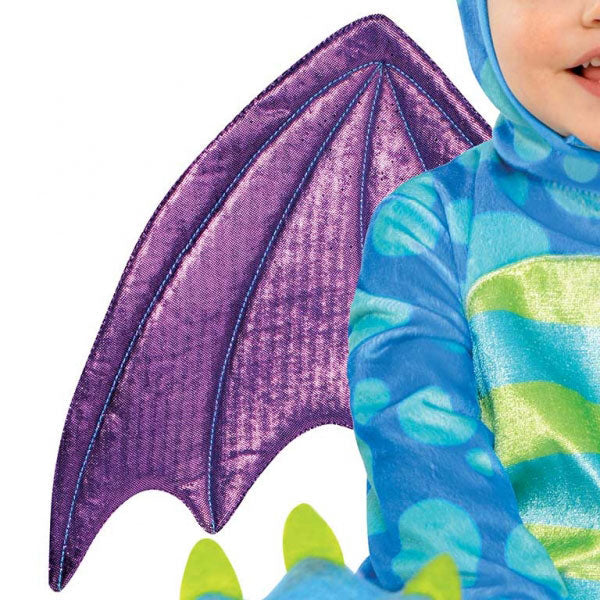 The Deluxe Little Dragon Costume includes a plush blue and green jumpsuit with attached spiked tail and detachable wings. The hood is shaped like a dragon face. The jumpsuit is has snap closures on the legs for easy nappy changes and skid-resistant bottoms on the attached dragon feet. Baby Deluxe Little Puff Dragon Costume includes jumpsuit, detachable wings and hood.
