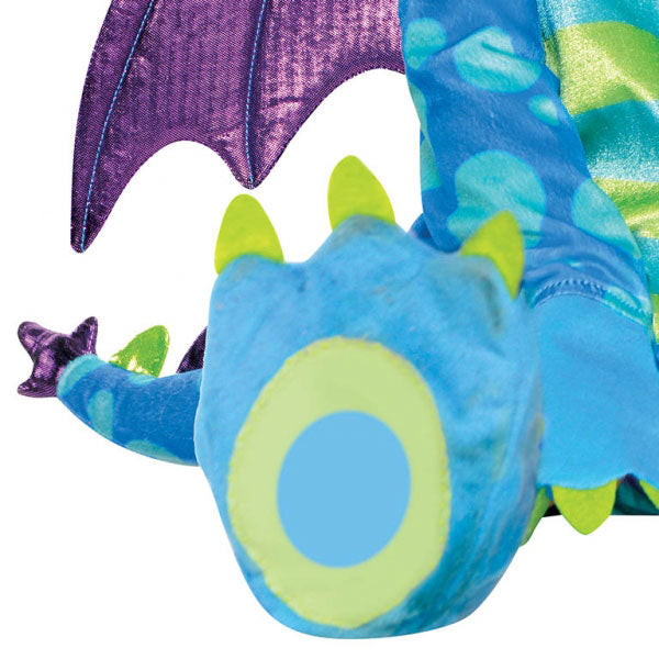 The Deluxe Little Dragon Costume includes a plush blue and green jumpsuit with attached spiked tail and detachable wings. The hood is shaped like a dragon face. The jumpsuit is has snap closures on the legs for easy nappy changes and skid-resistant bottoms on the attached dragon feet. Baby Deluxe Little Puff Dragon Costume includes jumpsuit, detachable wings and hood.