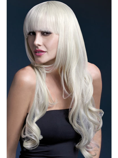 Fever Yasmin Professional Quality Synthetic Wig. Blonde. Long, loose curls with fringe and professional wig cap. Styleable and heat resistant to 120C/248F. 71cm.