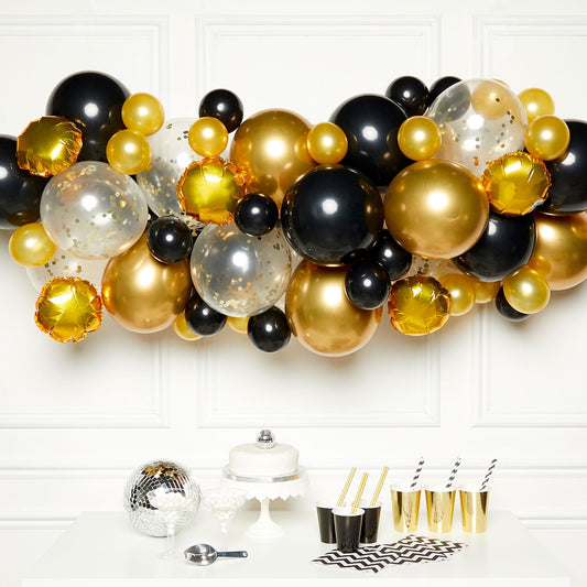 Black and Gold DIY Garland Balloon Kit includes 15 x 5inch Satin Luxe Gold Balloons| 15 x 5inch Black Balloons| 10 x 11inch Satin Luxe Gold Balloons| 10 x 11inch Black Balloons| 8 x 11inch Clear Confetti Filled Balloons| 2 x 14inch Black Balloons| 6 x 9inch Gold Foil Balloons| Sticky Dots and Balloon Tape.