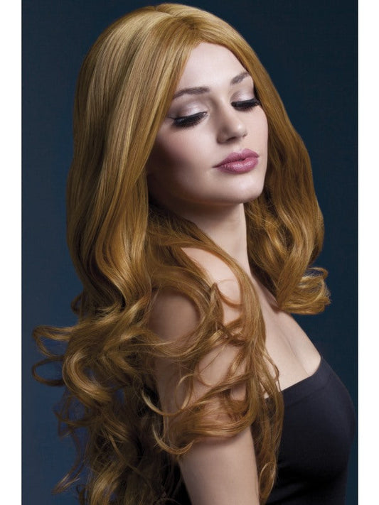 Fever Rhianne Professional Quality Synthetic Wig. Auburn. Long, curly with skin parting and professional wig cap. Styleable and heat resistant to 120C/248F.